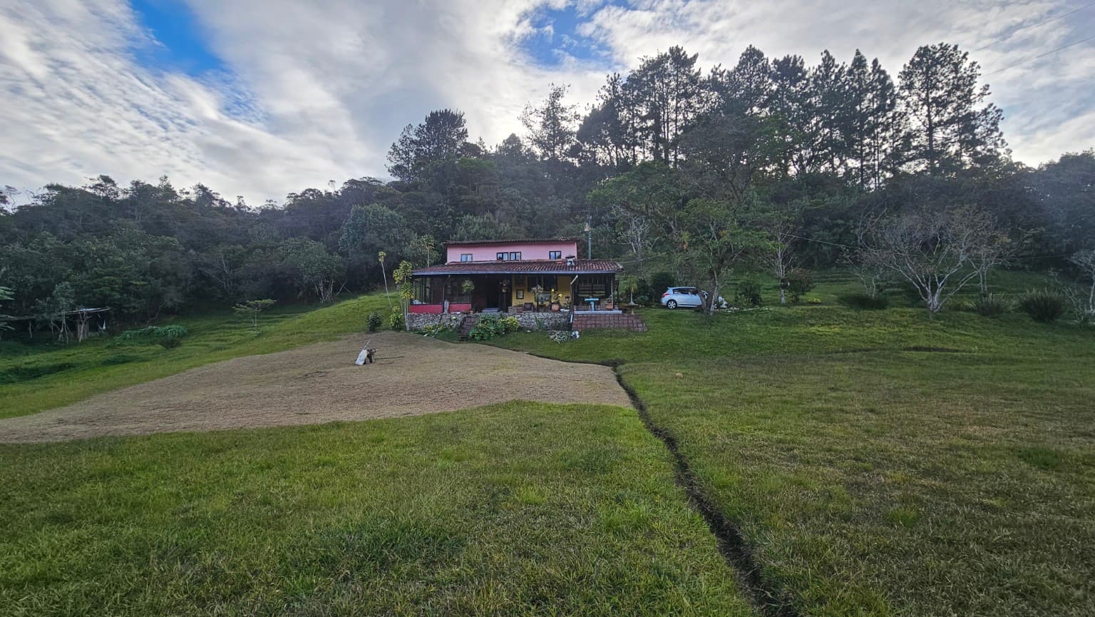 Real panoramic view of La Julia among lawns and forest
