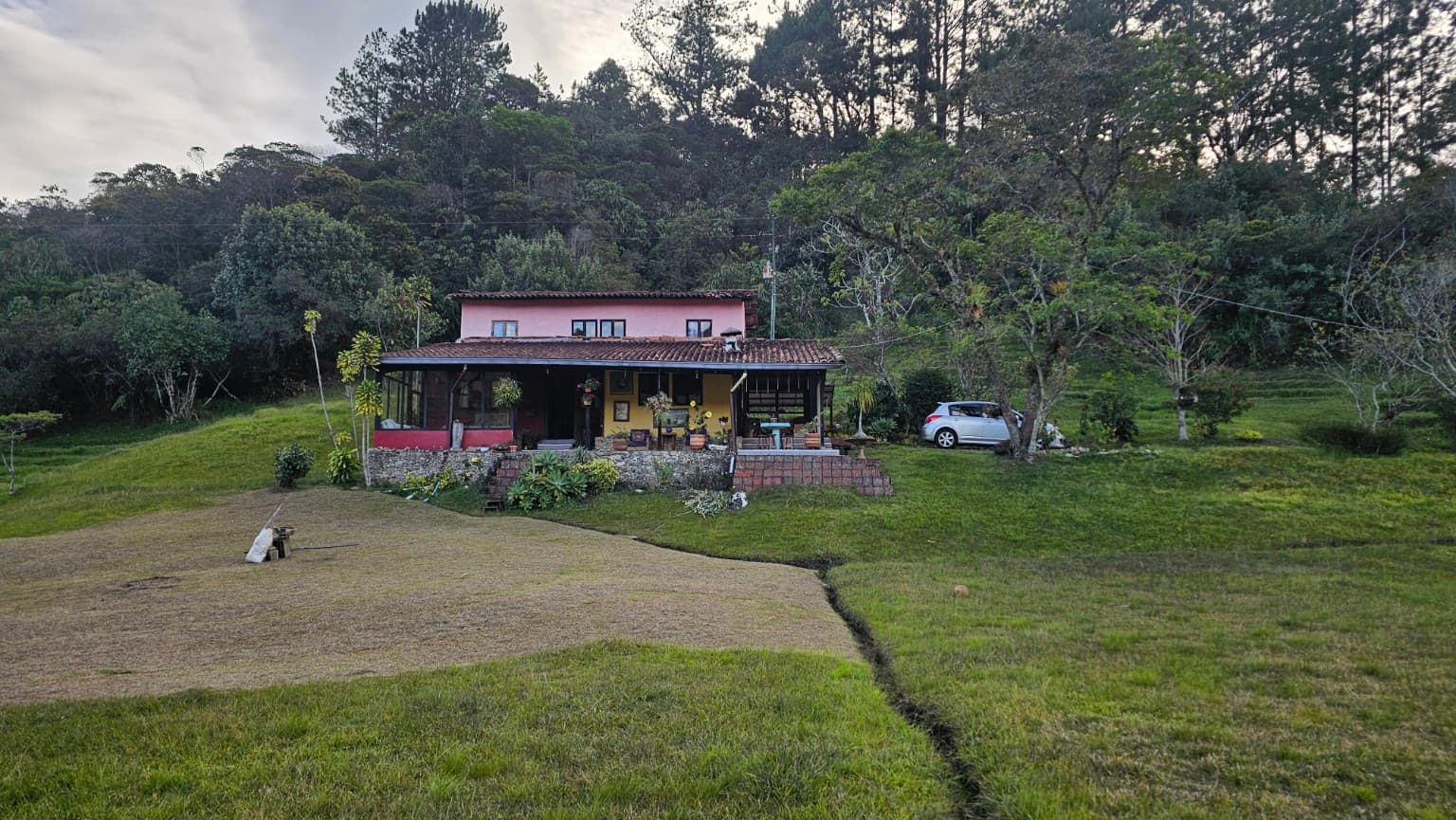 La Julia's yellow facade among gardens and trees