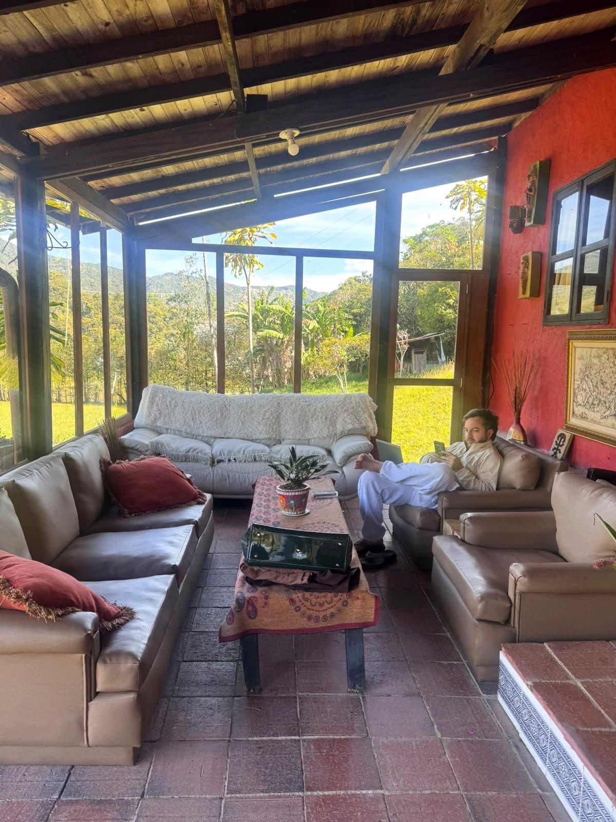 A guest using La Julia's veranda to work and rest