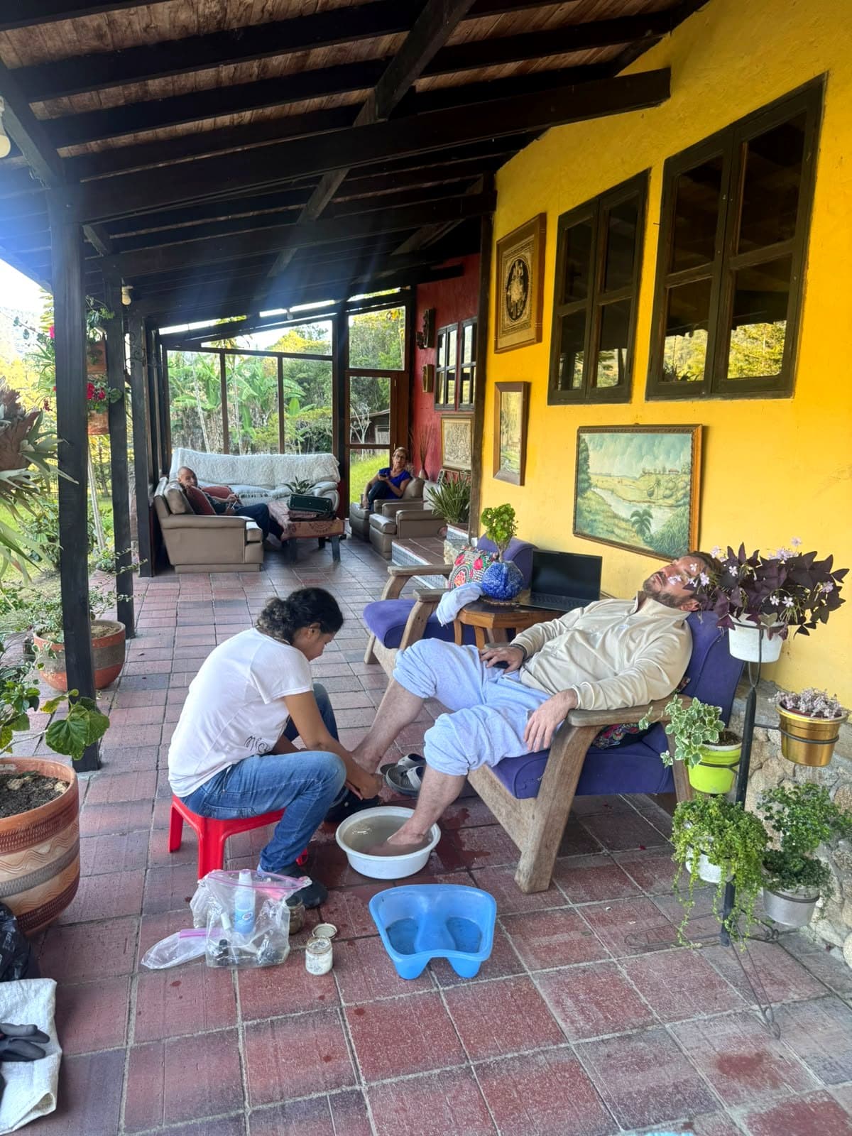 Margarita giving a foot massage on La Julia's veranda